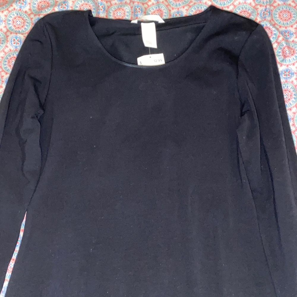An all black long sleeve dress